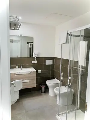 a bathroom with a toilet and a sink at Attico Belvedere in Palermo