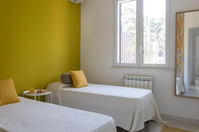 a room with two beds and a window at Nice home in Carini