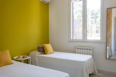 a room with two beds and a window at Nice home in Carini