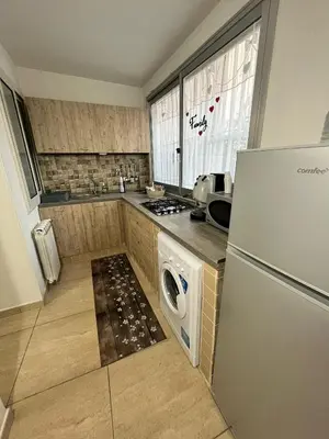 a kitchen with a washer and dryer in it at House del Corso in Palermo