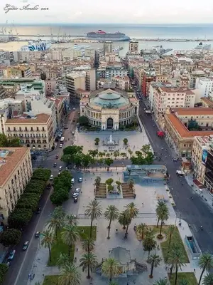 an aerial view of a city with buildings and palm trees at PortoAmuri in Palermo