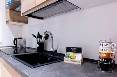 a kitchen with a sink and a counter top at SarAle Apartments in Palermo