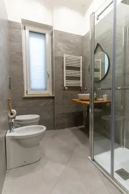 a bathroom with a toilet and a sink at Nena Sweet Home in Palermo