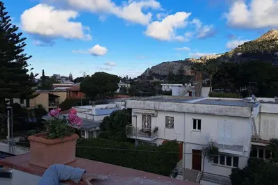 a view from the roof of a building at mansarda beach Mondello in Palermo