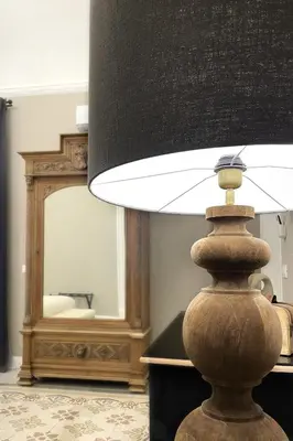 a lamp in a room with a mirror at Dimora Borghese “Whitaker” in Palermo