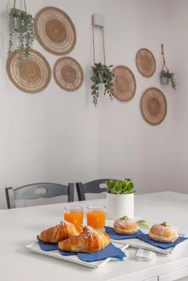 a table with croissants and glasses of orange juice at Suk Ballarò House in Palermo