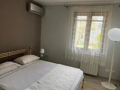 a bedroom with a bed and a window at Via delle Rose in Torretta
