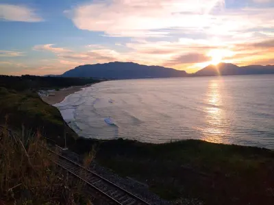 a sunset over the ocean with the sun setting at Casa vacanze Venere in Balestrate