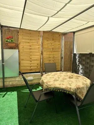 a tent with a table and chairs in a room at La Kalsa di Somavi in Palermo