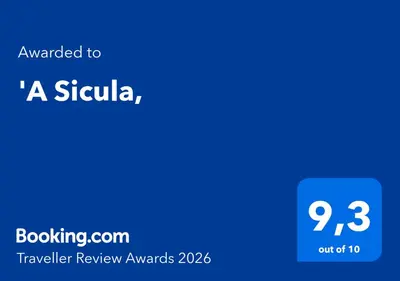 a blue screen with the text awarded to a skylka traveler review awards at 'A Sicula in Palermo