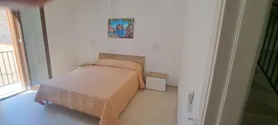 a small bedroom with a bed in a room at Mamma Rosa Casa Vacanze in Castellammare del Golfo