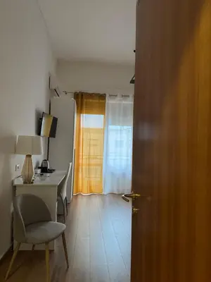 a bathroom with a sink and a toilet and a mirror at Crispi 120 Rooms New Opening in Palermo