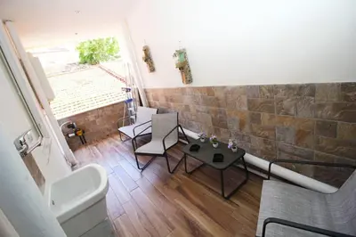a bathroom with a tub and a table in a room at La chiave dei sogni in Palermo