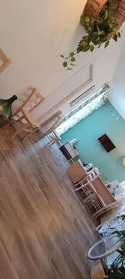 a room with chairs and a swimming pool at Green Suite Palermo in Palermo