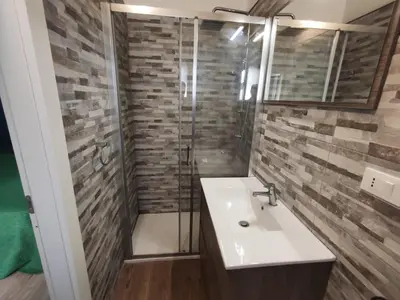 a bathroom with a sink and a shower at Medea rooms palermo centro in Palermo