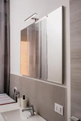 a bathroom with a sink and a mirror at VILLA HEMINGWAY - LA Casa di Alessia e La Casa di Leonardo in Ficarazzi
