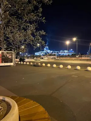 a parking lot at night with lights on at GDM central apartment Palermo in Palermo