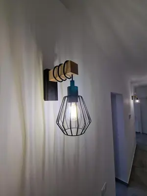 a lamp on a wall with a light on it at Villa Fragi in Cinisi