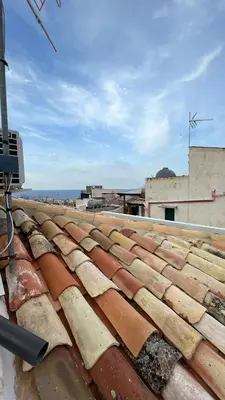 a tile roof with a camera on top of it at Zohra in Castellammare del Golfo
