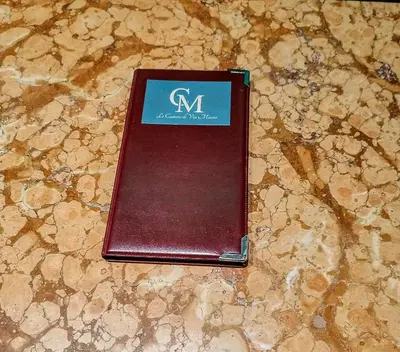 a wallet sitting on top of a table at LE CAMERE DI VIA MECCIO in Palermo