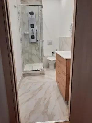 a bathroom with a shower and a toilet at LE CAMERE DI VIA MECCIO in Palermo