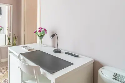 a bathroom with a sink and a toilet at B&B Handy Palermo in Palermo