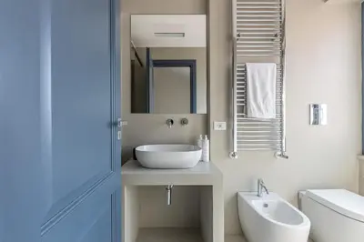 a bathroom with a sink and a mirror at Porta di Castro Design Apartment with Terrace by Wonderful Italy in Palermo