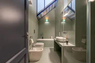 a bathroom with two sinks and two toilets at Porta di Castro Design Apartment with Terrace by Wonderful Italy in Palermo