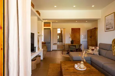 a living room with a couch and a table at Villa Bellacosa con Piscina Privata vista mare in Castellammare del Golfo