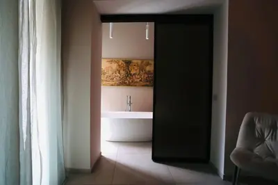 a bathroom with a bath tub and a sink at Guest House Colonna in Palermo