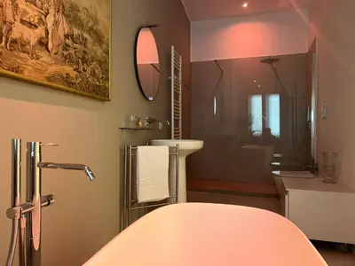 a bathroom with a shower and a sink and a tub at Guest House Colonna in Palermo