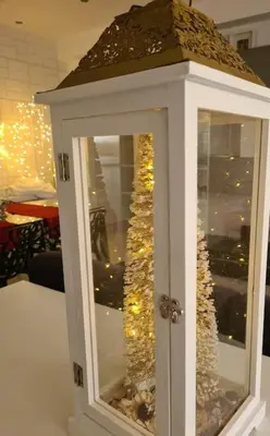 a white cabinet with a christmas tree in it at Energy Home in Palermo