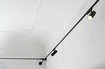 a white ceiling with two lights on it at Eligius Luxury Apartments in Palermo
