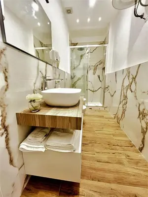 a bathroom with a sink and a mirror at wood & white home in Palermo