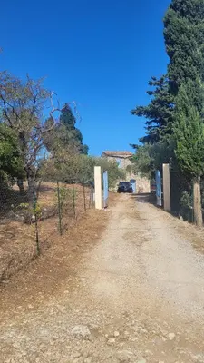 a dirt road with a car parked on the side at Villa Jesabel in Scopello