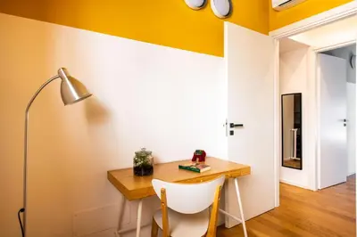 a kitchen with a black counter top in a room at Pomodoro House allo Spasimo by Wonderful Italy in Palermo