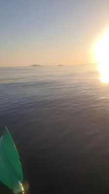 a view of the ocean with the sun rising over the water at Casa Poseidonia - intero alloggio in riva al mare in Carini