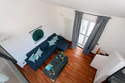an overhead view of a living room with a blue couch at Vicolo Paternò Apartments in Palermo