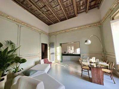 a living room with a couch and a table at Casa Guilla_alla Cattedrale in Palermo