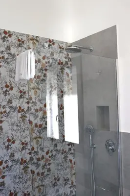 a bathroom with a shower with a shower curtain at Elimi Home Appartamenti in Nuova Gibellina