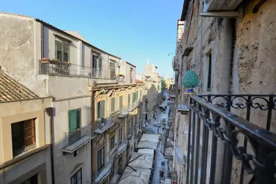 a view of a city street from a balcony at iFlat Dimora del Cassaro in Palermo