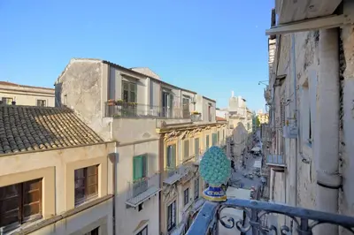 a view of a city street with buildings at iFlat Dimora del Cassaro in Palermo