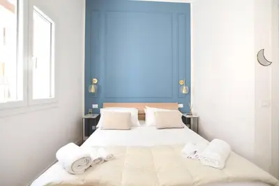 a bedroom with a large bed with towels on it at iFlat Casa Isabella in Palermo