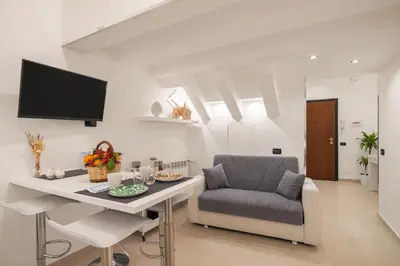 a living room with a desk and a chair at Iverlid Home. in Palermo