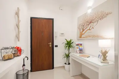 a room with a desk and a wooden door at Iverlid Home. in Palermo